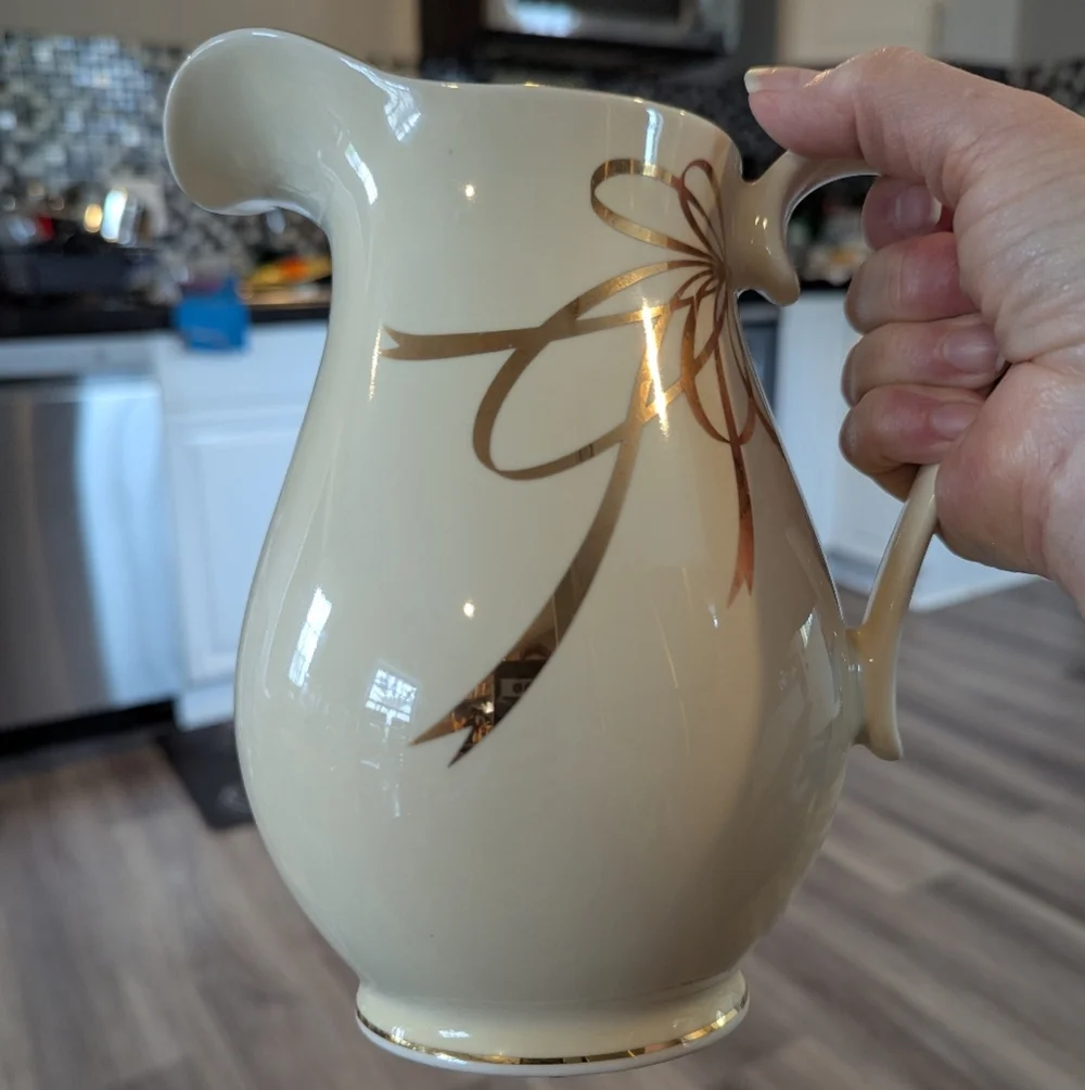 Elegant Cream Pitcher with Gold Ribbon Design